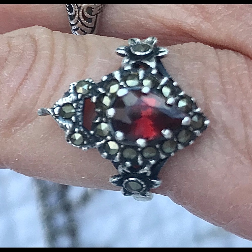 Silver ring with garnet stone